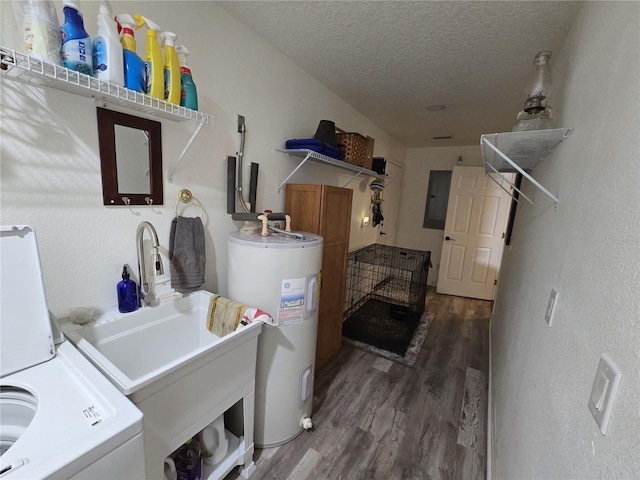 laundry room with dark wood finished floors, water heater, laundry area, washer / dryer, and a textured ceiling