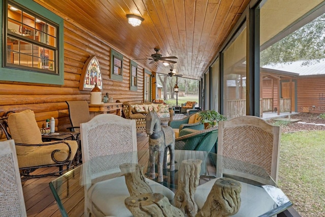 sunroom with wooden ceiling, a wealth of natural light, and ceiling fan