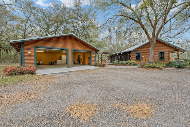 view of home's exterior with an outbuilding and a garage