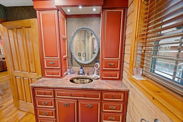 bathroom with vanity and wood finished floors