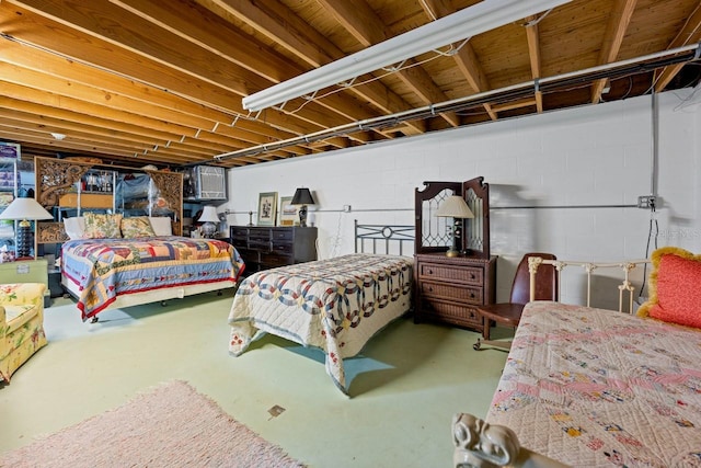 bedroom featuring concrete floors