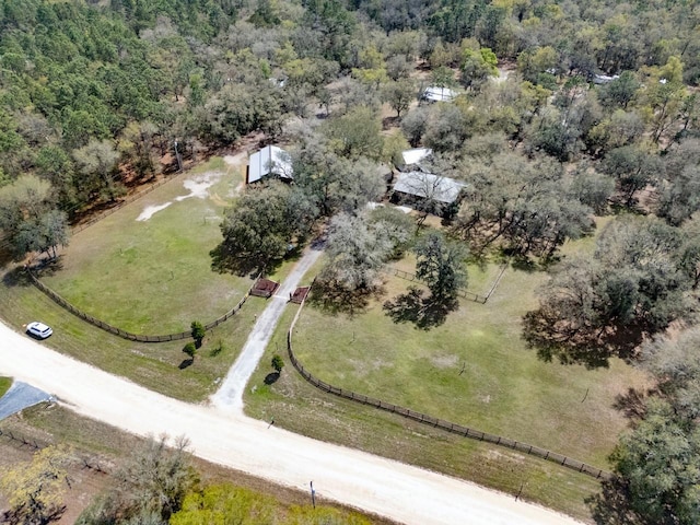 birds eye view of property with a rural view