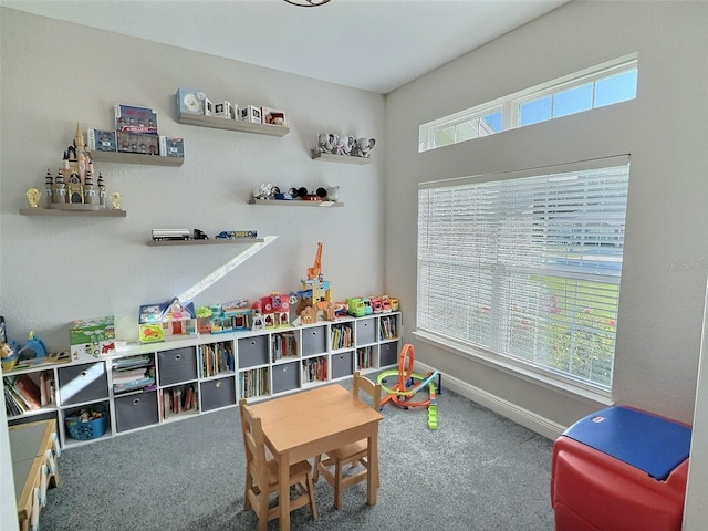 playroom featuring baseboards and carpet floors