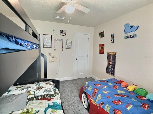 bedroom featuring visible vents, baseboards, a textured ceiling, and carpet flooring