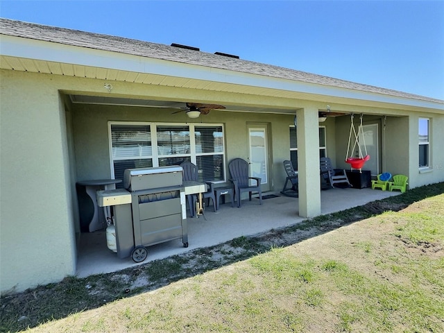 view of patio / terrace with area for grilling and a ceiling fan