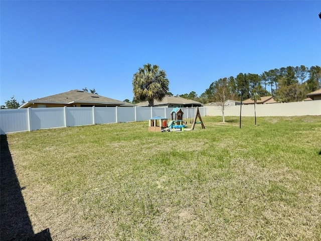 view of yard with a fenced backyard