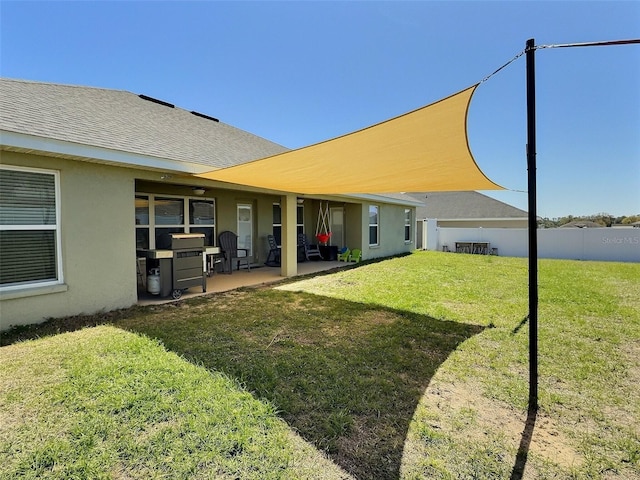 view of yard featuring a patio area and fence