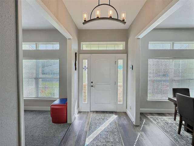 1034 SE 65th Cir, Ocala, FL 34472 - foyer entrance with wood finished floors and a chandelier