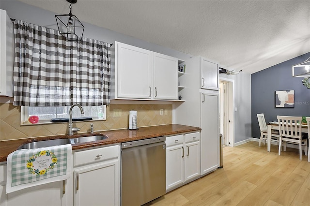 kitchen with tasteful backsplash, a sink, dishwasher, light wood-style flooring, and open shelves