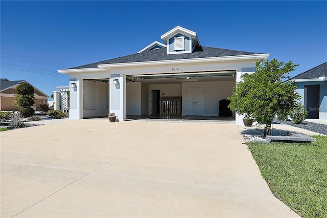 7014 Elaine Ct, The Villages, FL 34762 - view of front of home with an attached garage, roof with shingles, and driveway