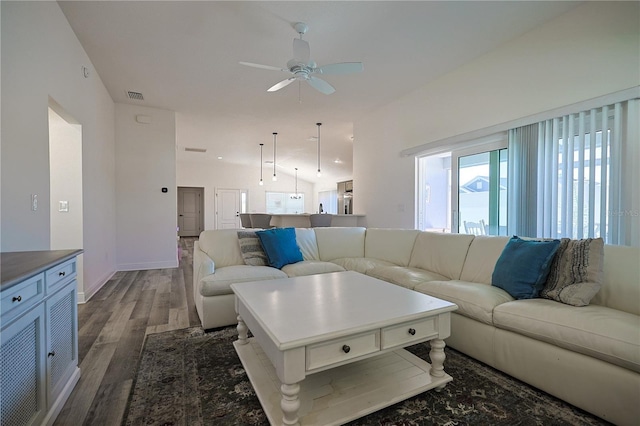 7014 Elaine Ct, The Villages, FL 34762 - living area with visible vents, wood finished floors, baseboards, ceiling fan, and vaulted ceiling