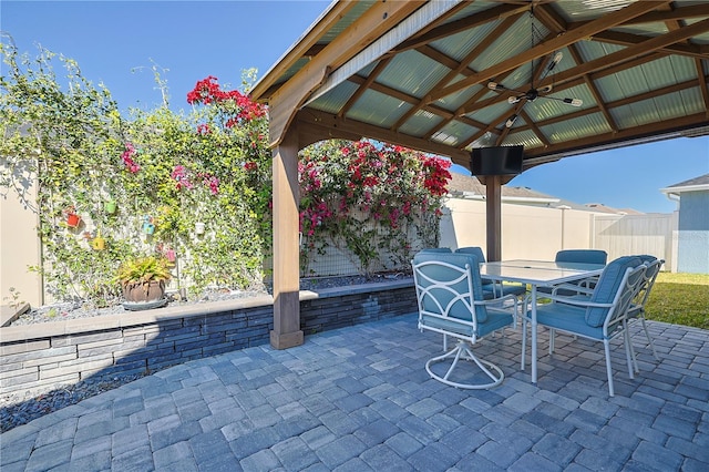 7014 Elaine Ct, The Villages, FL 34762 - view of patio featuring a gazebo, outdoor dining area, and fence