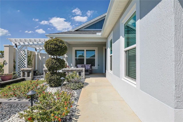 7014 Elaine Ct, The Villages, FL 34762 - property entrance featuring board and batten siding, a pergola, and stucco siding