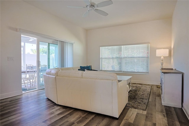 7014 Elaine Ct, The Villages, FL 34762 - living room featuring baseboards, dark wood-type flooring, and a ceiling fan