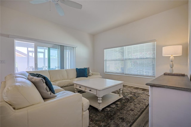 7014 Elaine Ct, The Villages, FL 34762 - living room featuring baseboards, a ceiling fan, and dark wood-style flooring