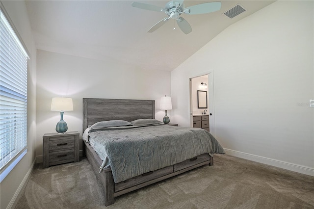 7014 Elaine Ct, The Villages, FL 34762 - carpeted bedroom featuring visible vents, ensuite bathroom, baseboards, ceiling fan, and vaulted ceiling