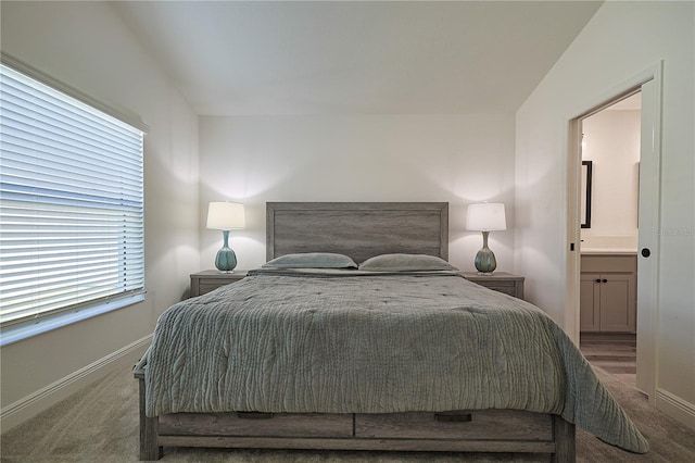 7014 Elaine Ct, The Villages, FL 34762 - bedroom with baseboards, carpet, and ensuite bathroom