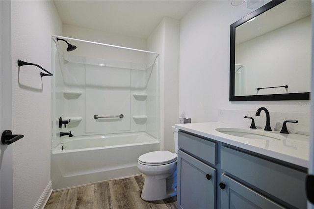 7014 Elaine Ct, The Villages, FL 34762 - bathroom featuring washtub / shower combination, toilet, vanity, and wood finished floors