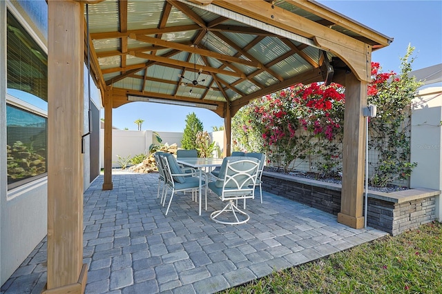 7014 Elaine Ct, The Villages, FL 34762 - view of patio / terrace with a gazebo, outdoor dining area, and a fenced backyard
