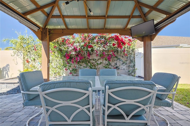 7014 Elaine Ct, The Villages, FL 34762 - view of patio featuring outdoor dining space, a gazebo, and fence