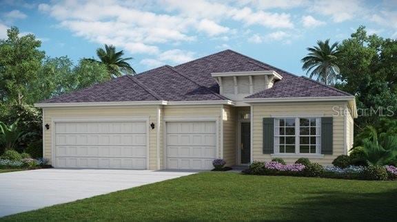 view of front of home featuring a front yard, concrete driveway, and a garage