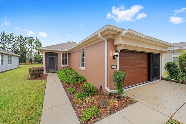 ranch-style home featuring stucco siding, driveway, a front lawn, and a garage