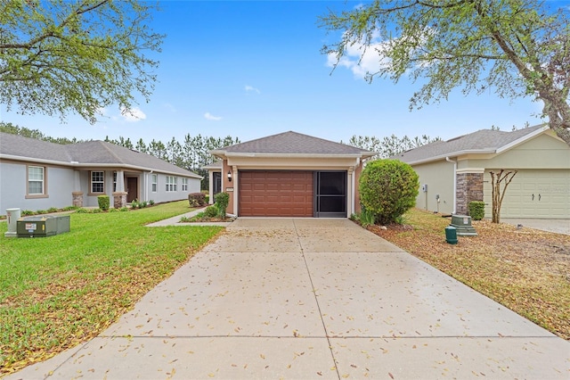 ranch-style house with stucco siding, a garage, concrete driveway, and a front lawn