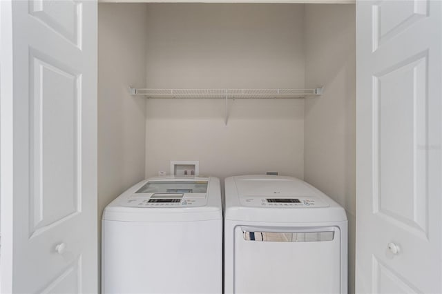 clothes washing area with laundry area and washing machine and dryer