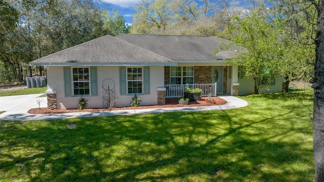 ranch-style home featuring a porch, a front yard, roof with shingles, and stucco siding