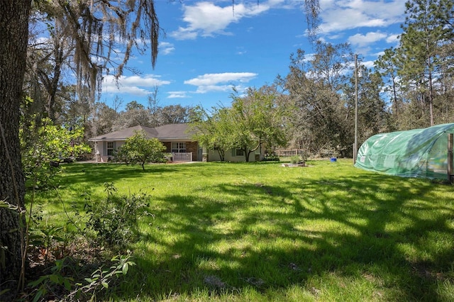 view of yard with an exterior structure and an outdoor structure