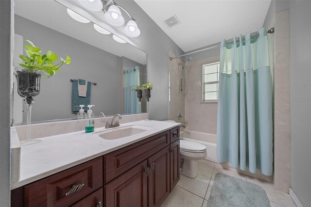 full bathroom with visible vents, shower / tub combo with curtain, toilet, tile patterned flooring, and vanity