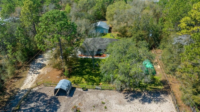 birds eye view of property with a forest view