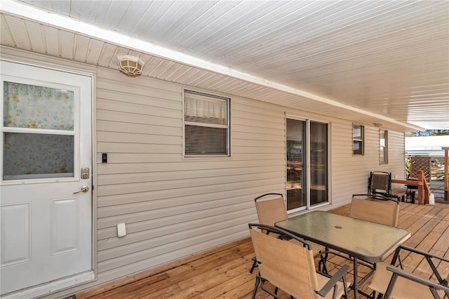 deck with outdoor dining space