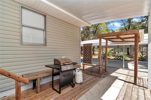 deck featuring a patio area and a grill