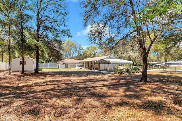 view of yard with an outbuilding and fence