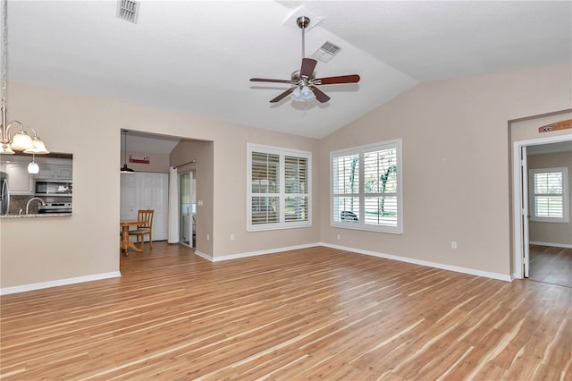 unfurnished living room featuring visible vents, light wood-style flooring, ceiling fan, and vaulted ceiling