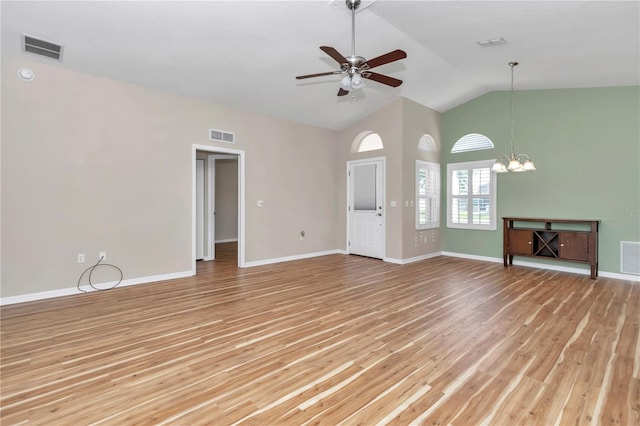 unfurnished living room with ceiling fan with notable chandelier, lofted ceiling, light wood-style floors, and visible vents