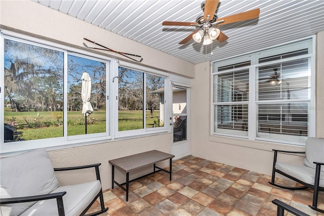 sunroom / solarium with ceiling fan