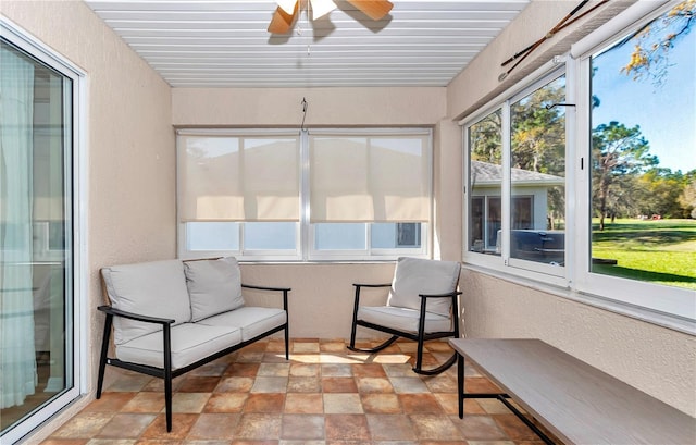 sunroom / solarium with ceiling fan