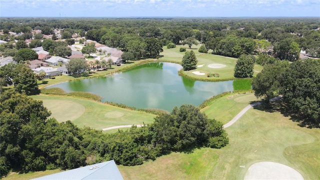 bird's eye view featuring a forest view, a water view, and view of golf course