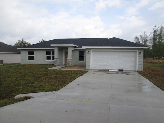 view of front of property with a garage, a front yard, roof with shingles, and driveway