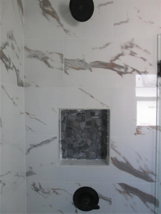 details featuring a tile shower