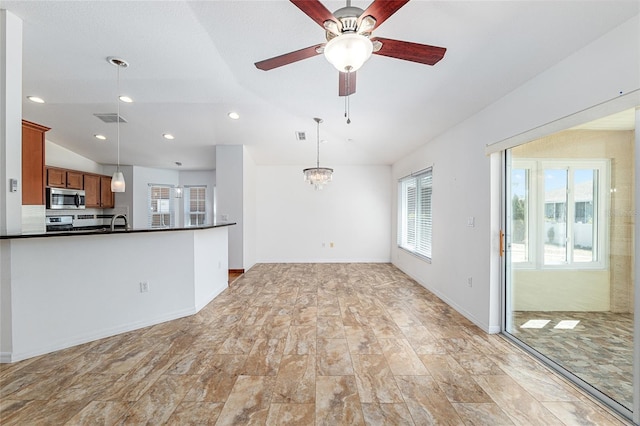 unfurnished living room featuring recessed lighting, visible vents, plenty of natural light, and lofted ceiling