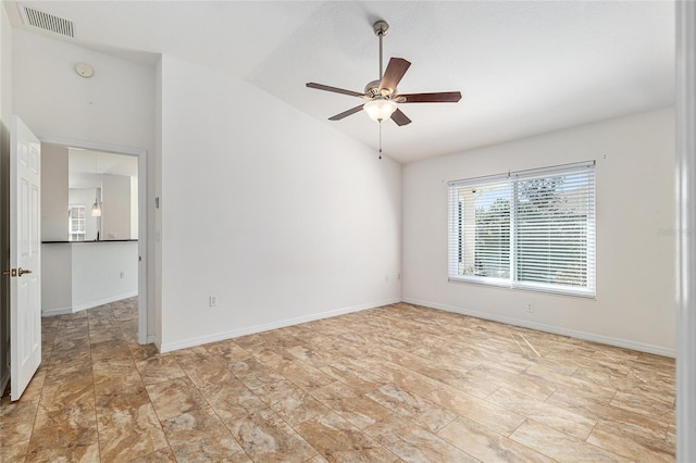 unfurnished room featuring lofted ceiling, a ceiling fan, visible vents, and baseboards