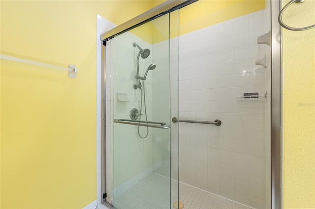 full bath with a shower stall