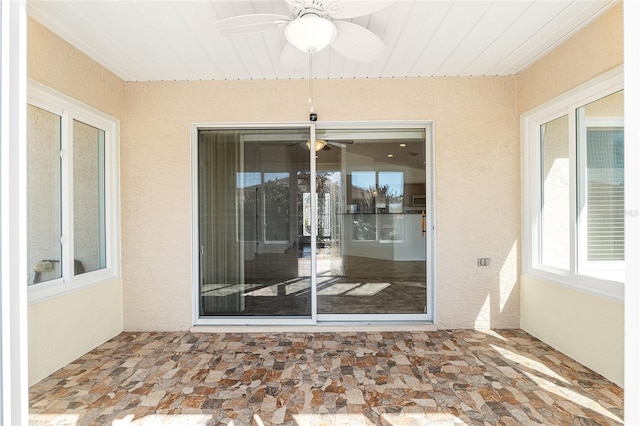 view of patio featuring ceiling fan