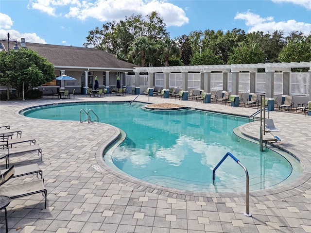 community pool featuring a patio area