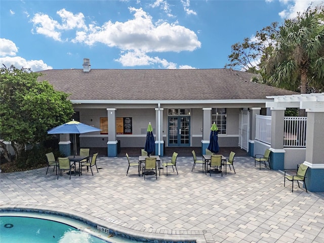 view of pool featuring a patio area, french doors, and a pergola