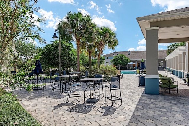 view of patio with an outdoor pool