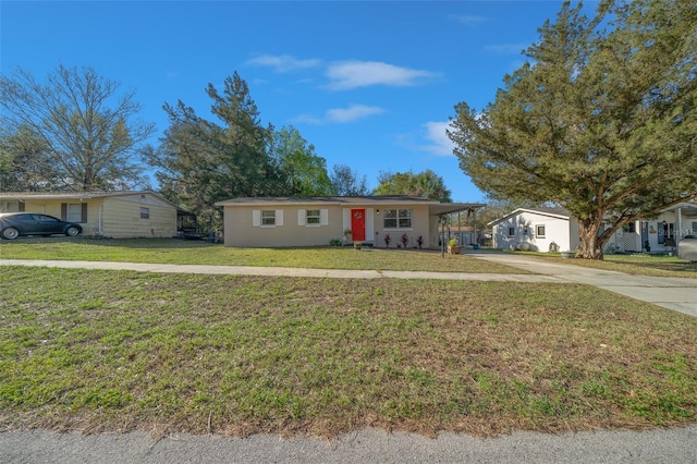 single story home featuring a front lawn and driveway